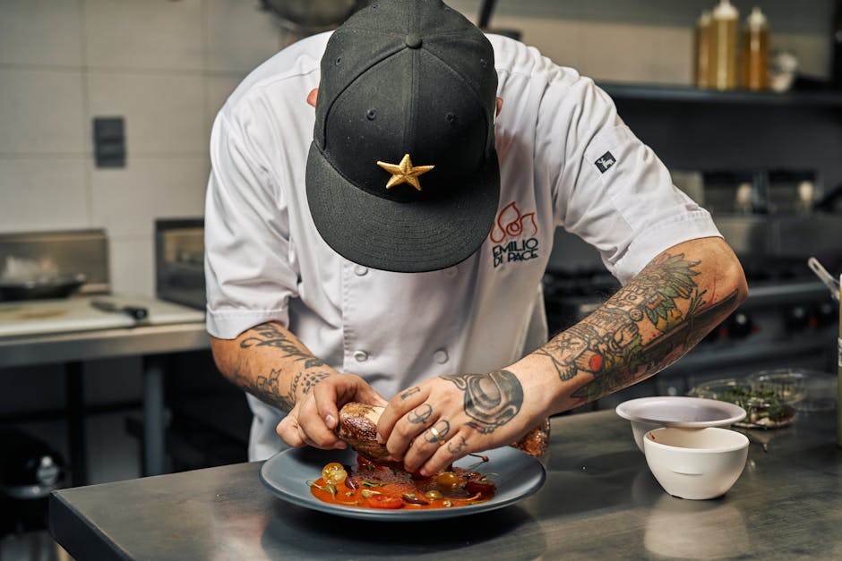 Chef meticulously plating gourmet food